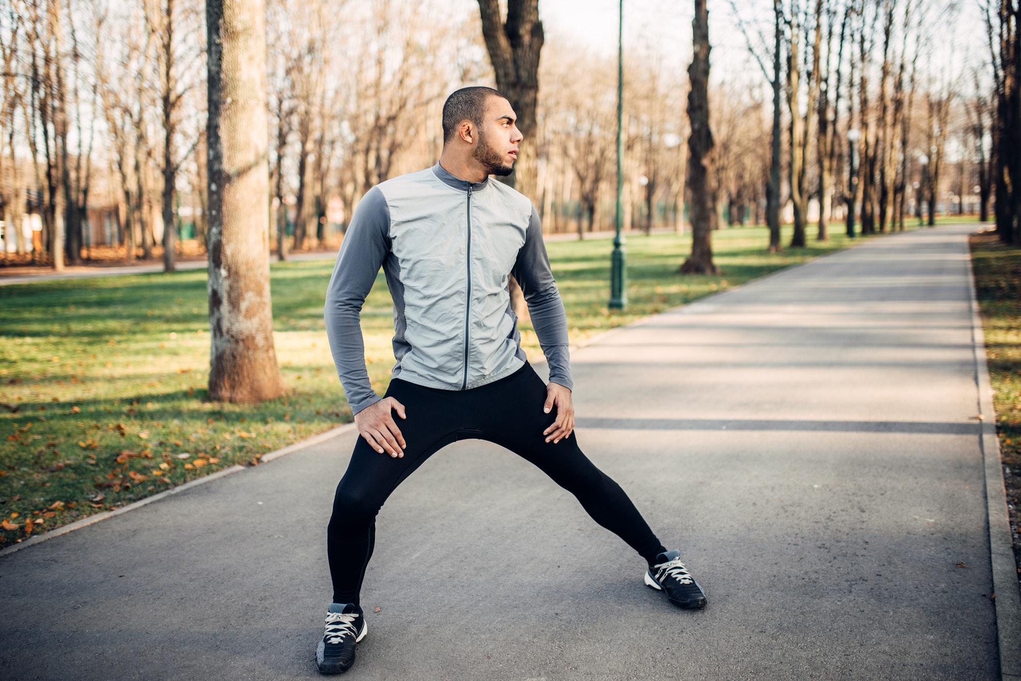 Athlete doing stretching exercise before running