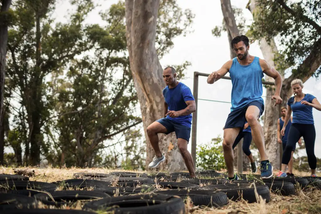 People receiving tire obstacle course training