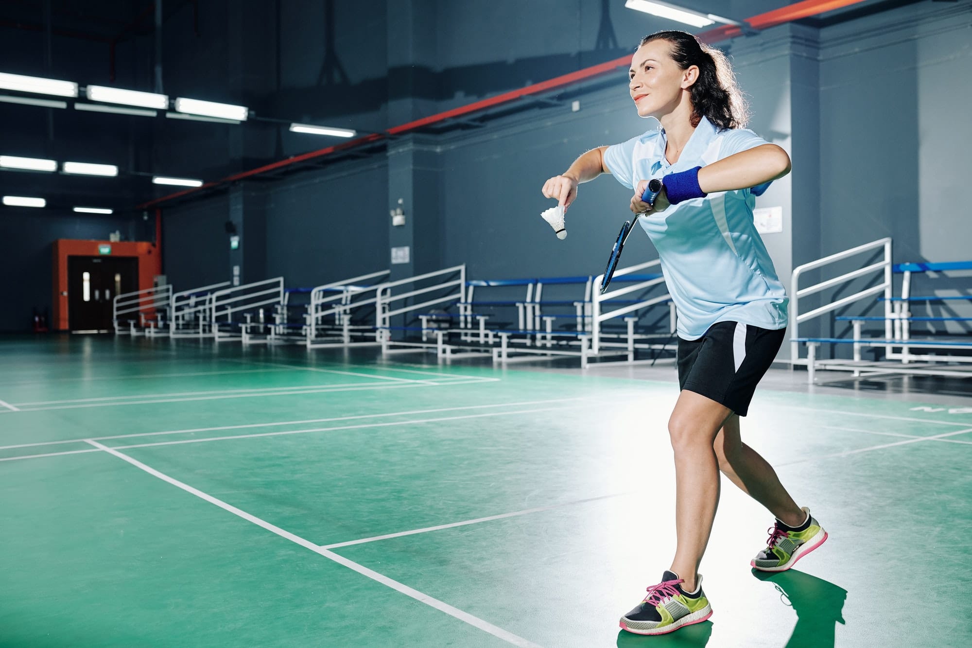 Woman playing badminton