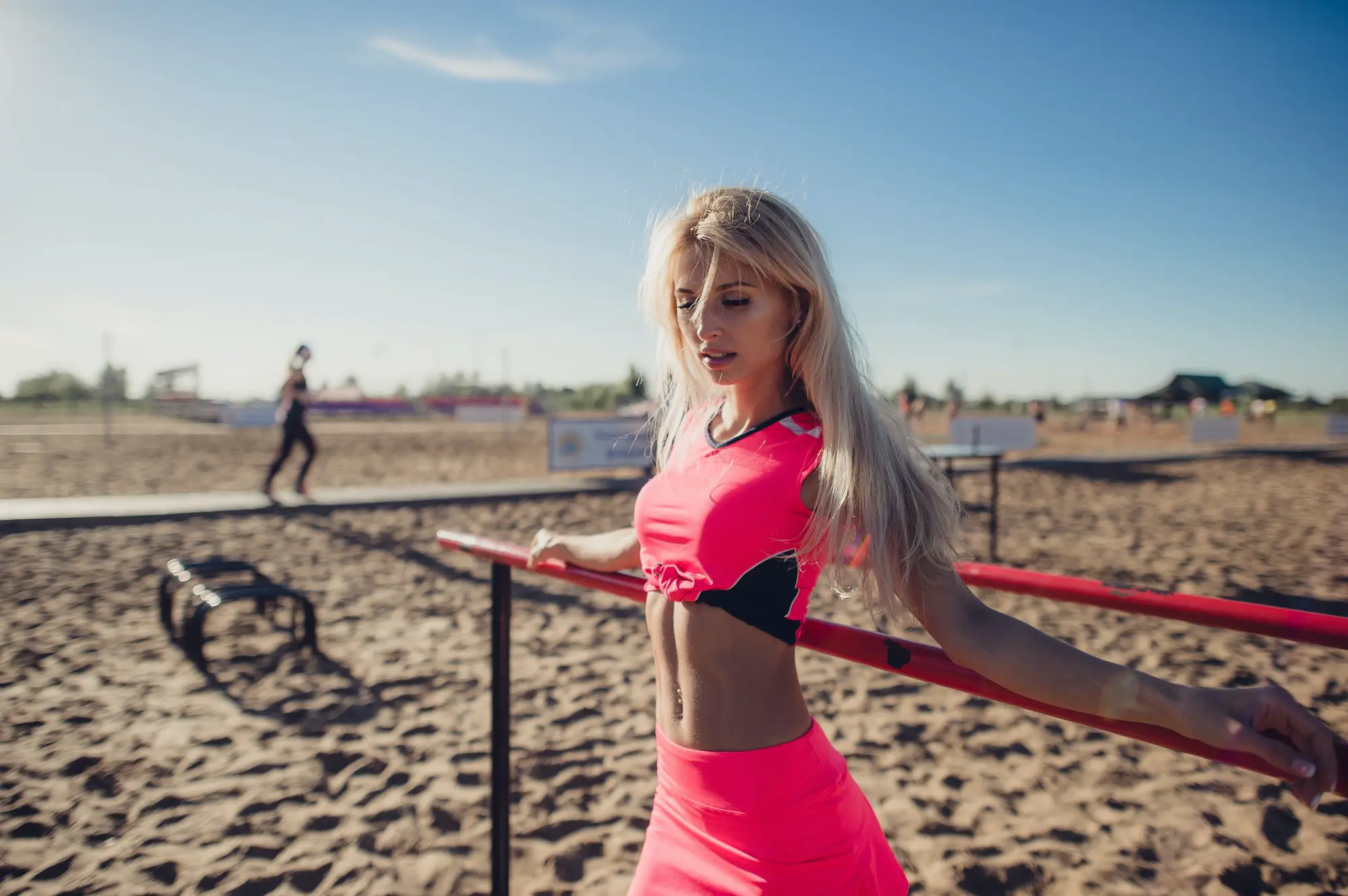 Beautiful athlete woman doing sport exercising on the beach