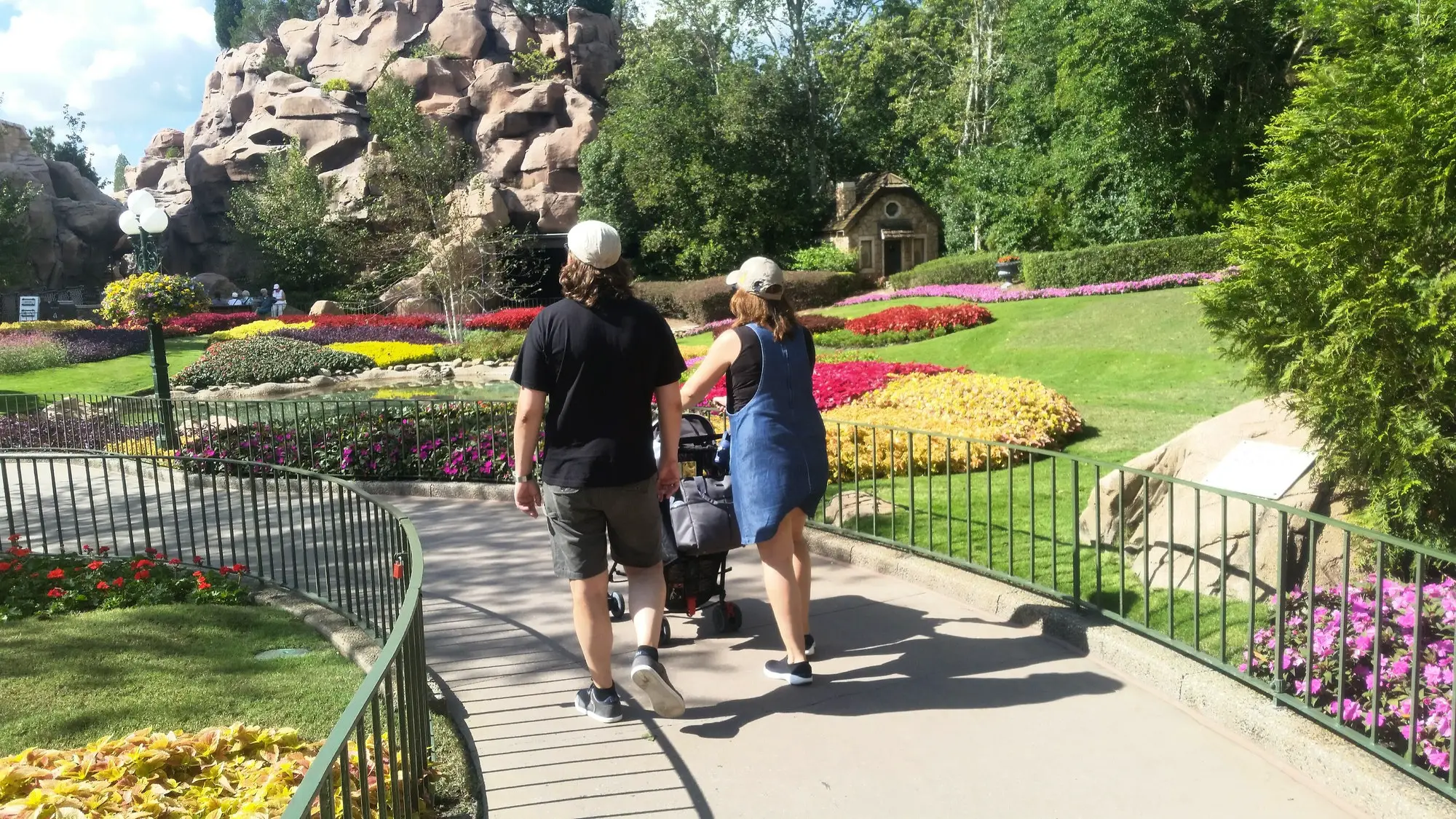 Natures beauty and moments in nature seen in Disneyland by strolling couple with child.