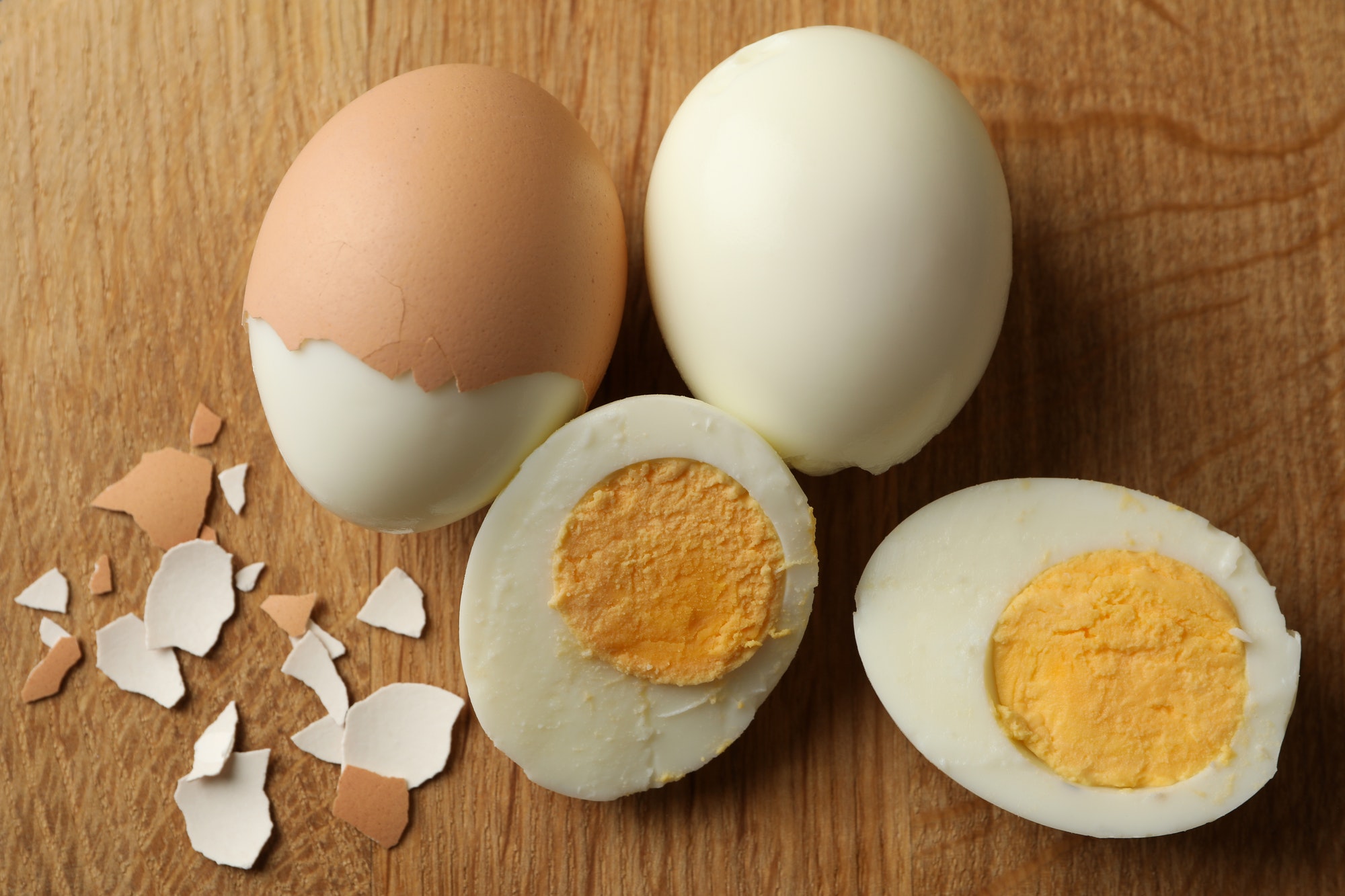 Board with hard boiled eggs, close up