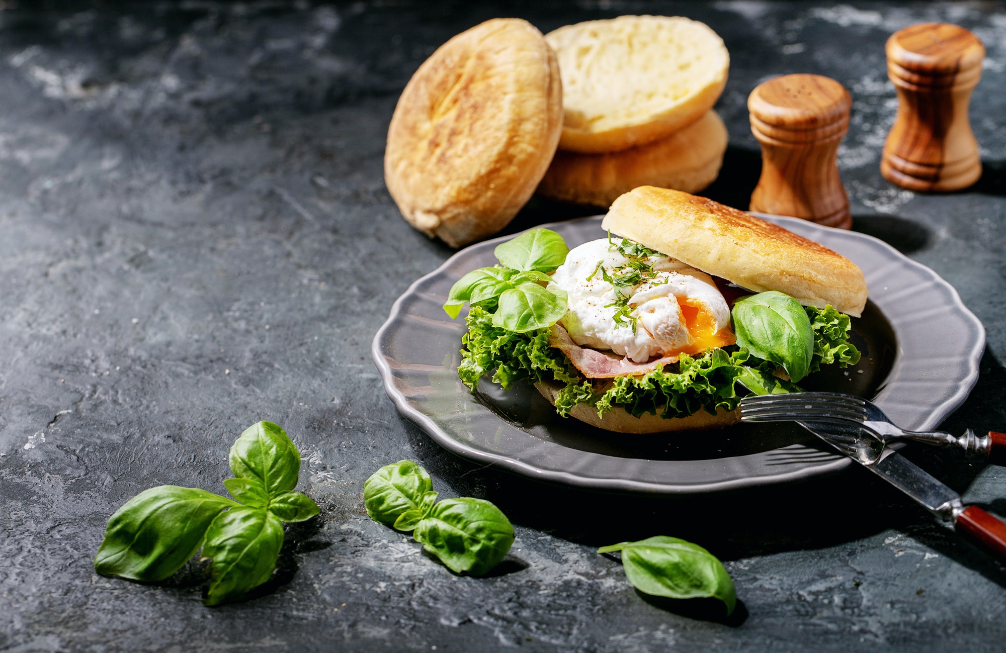 Cooked egg benedict served with english muffins