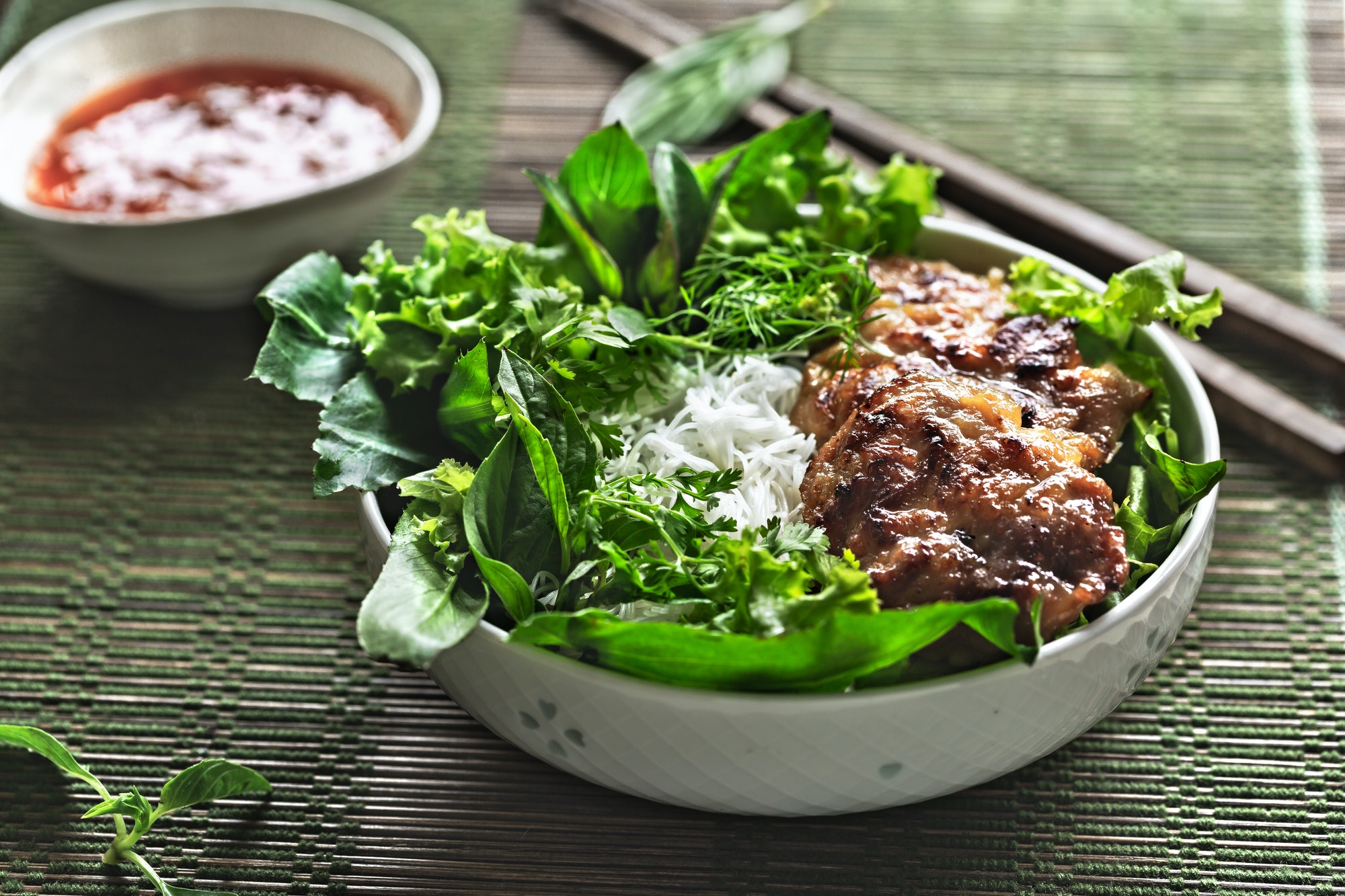 Vietnamese Rice Noodles with Grilled Pork and fresh vegetables and Chilli Sauce