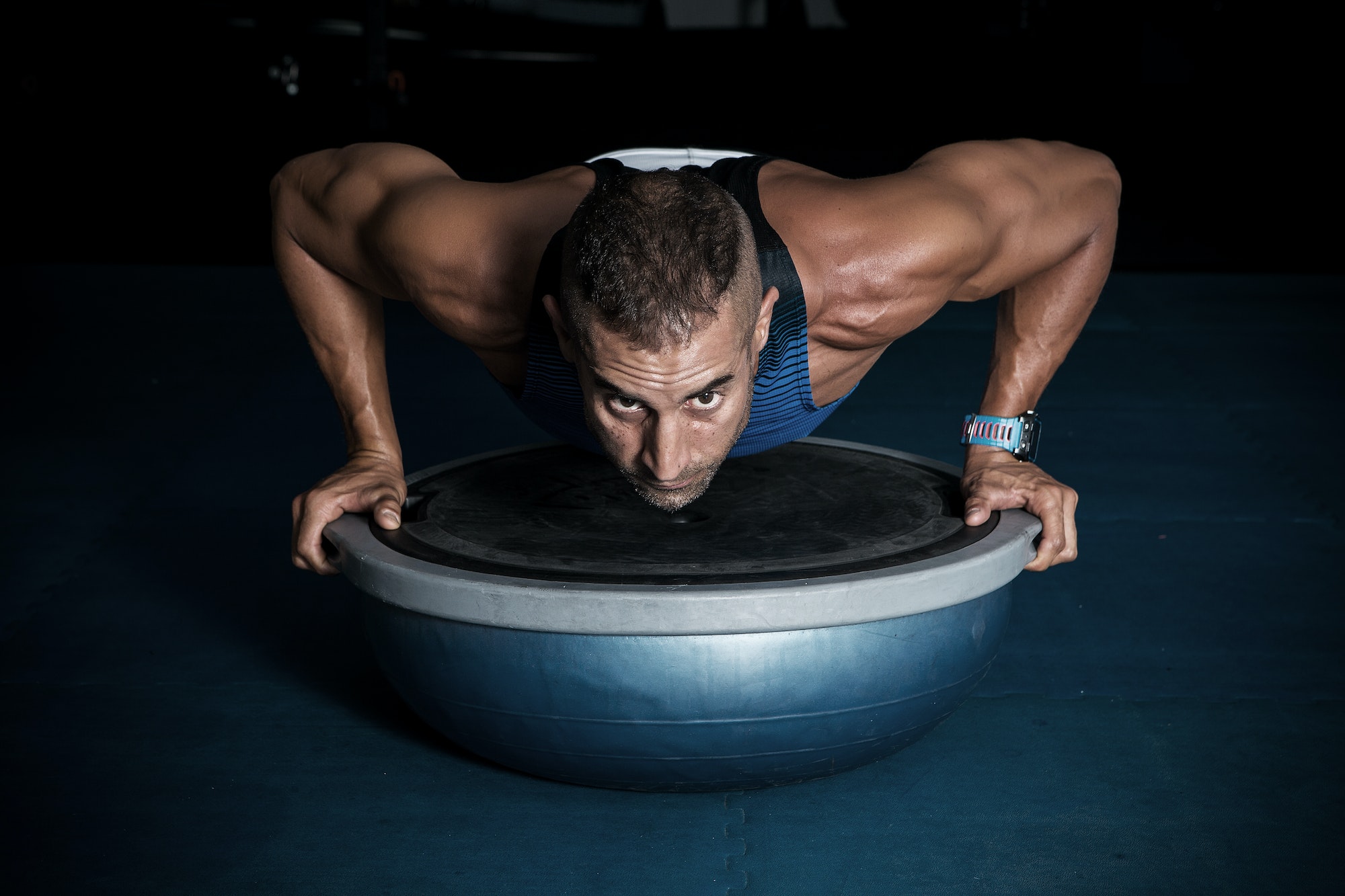 Athlete doing push-ups on balancing ball