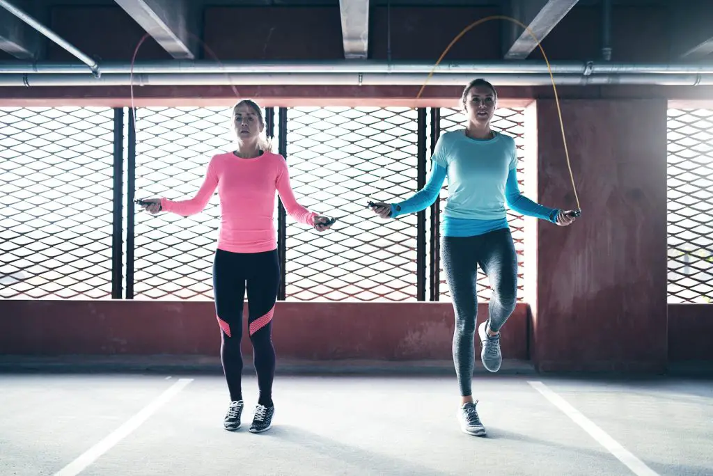 Sporty women doing jumping rope