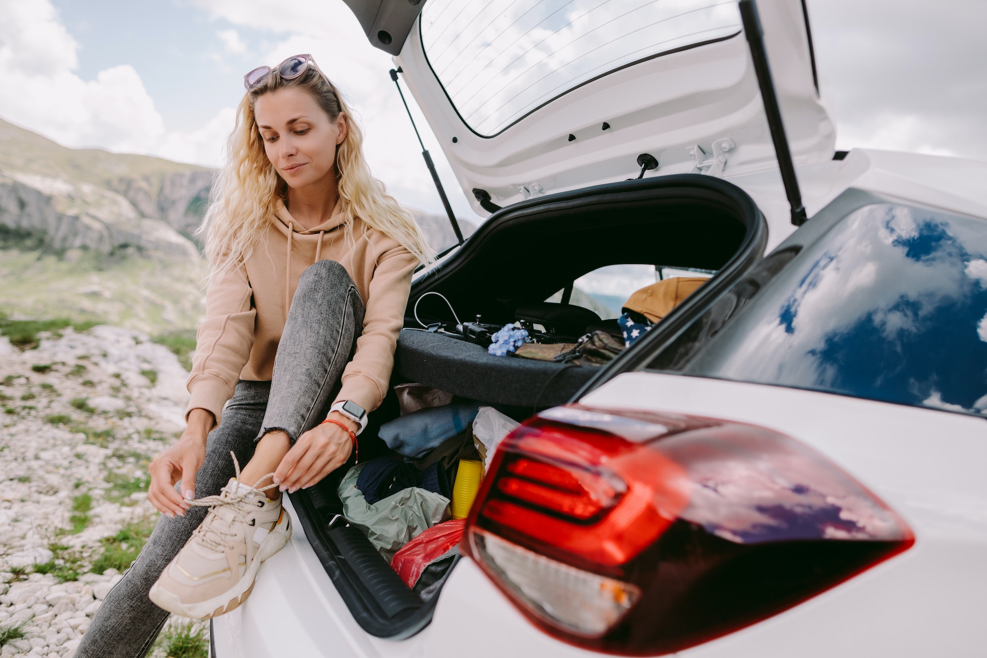 woman on road trip in mountains