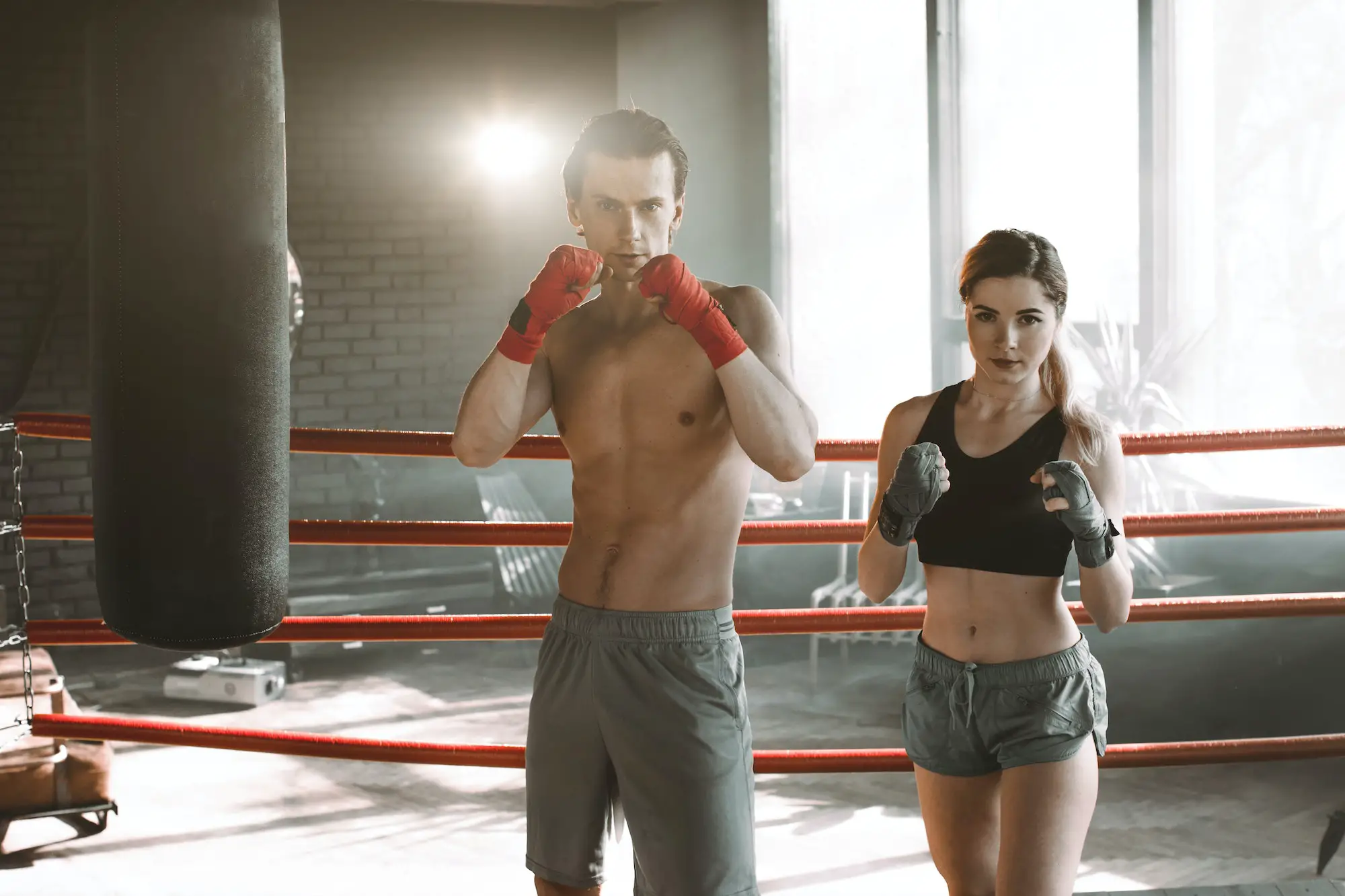 Woman on boxing training with personal trainer
